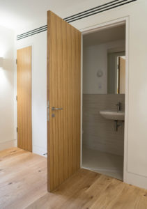 wooden panel bathroom door