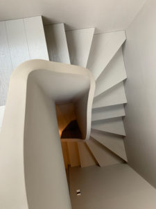 minimal white curved staircase