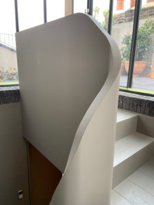 minimal white curved staircase