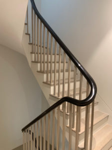 light grey staircase with black bannister