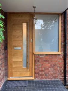 modern wood door with long window and side window