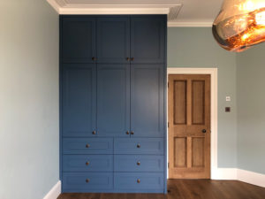 blue full height wardrobe and chest of drawers