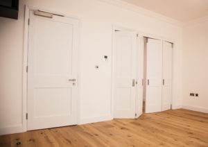 white bifold doors and normal door