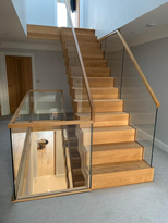 floating open wooden staircase