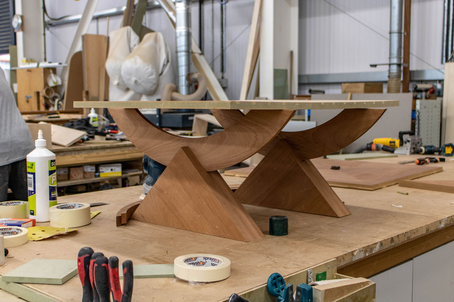 small unique wooden table in joinery workshop