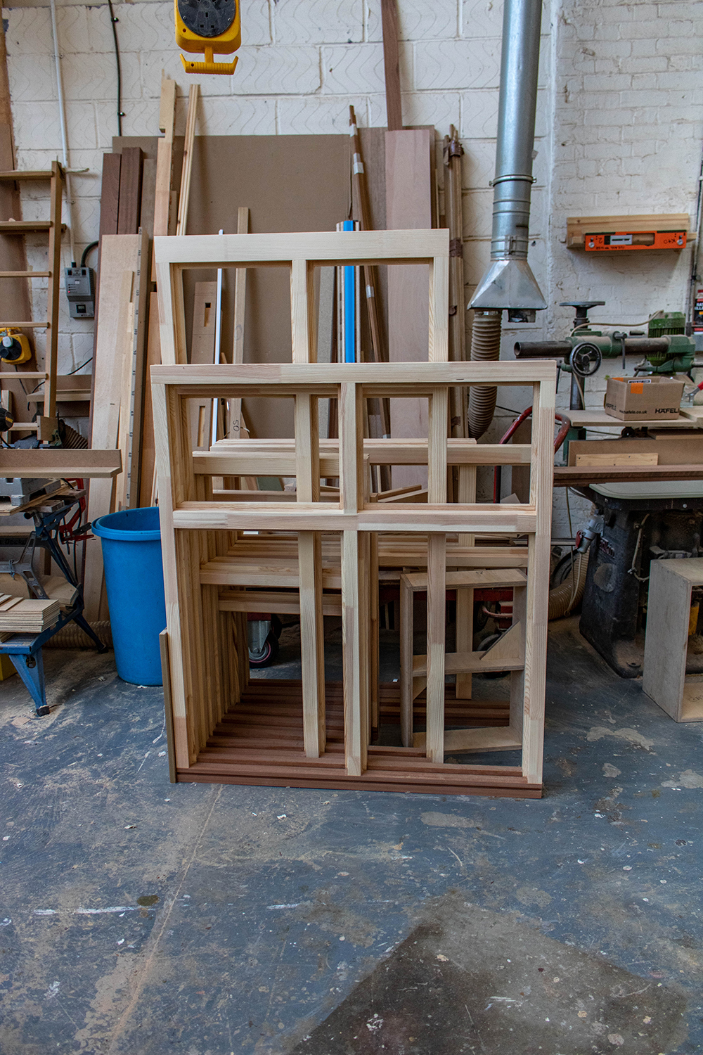 Set of wooden window frames in joinery workshop