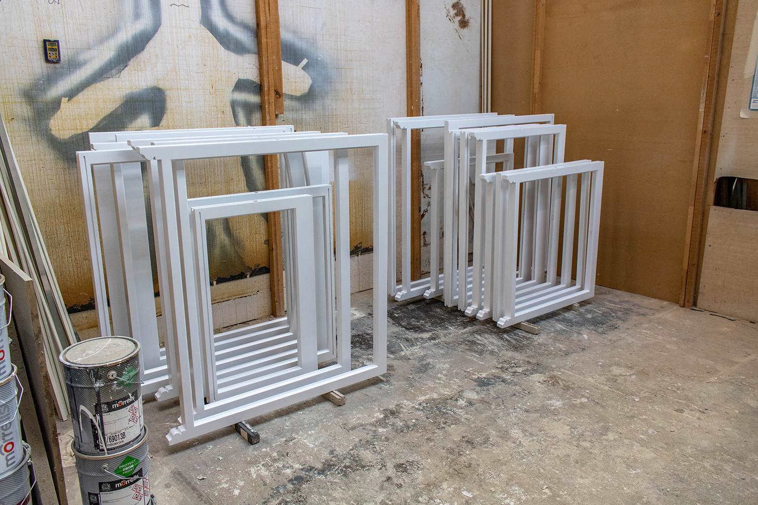 stacks of pvc window frames in joinery workshop