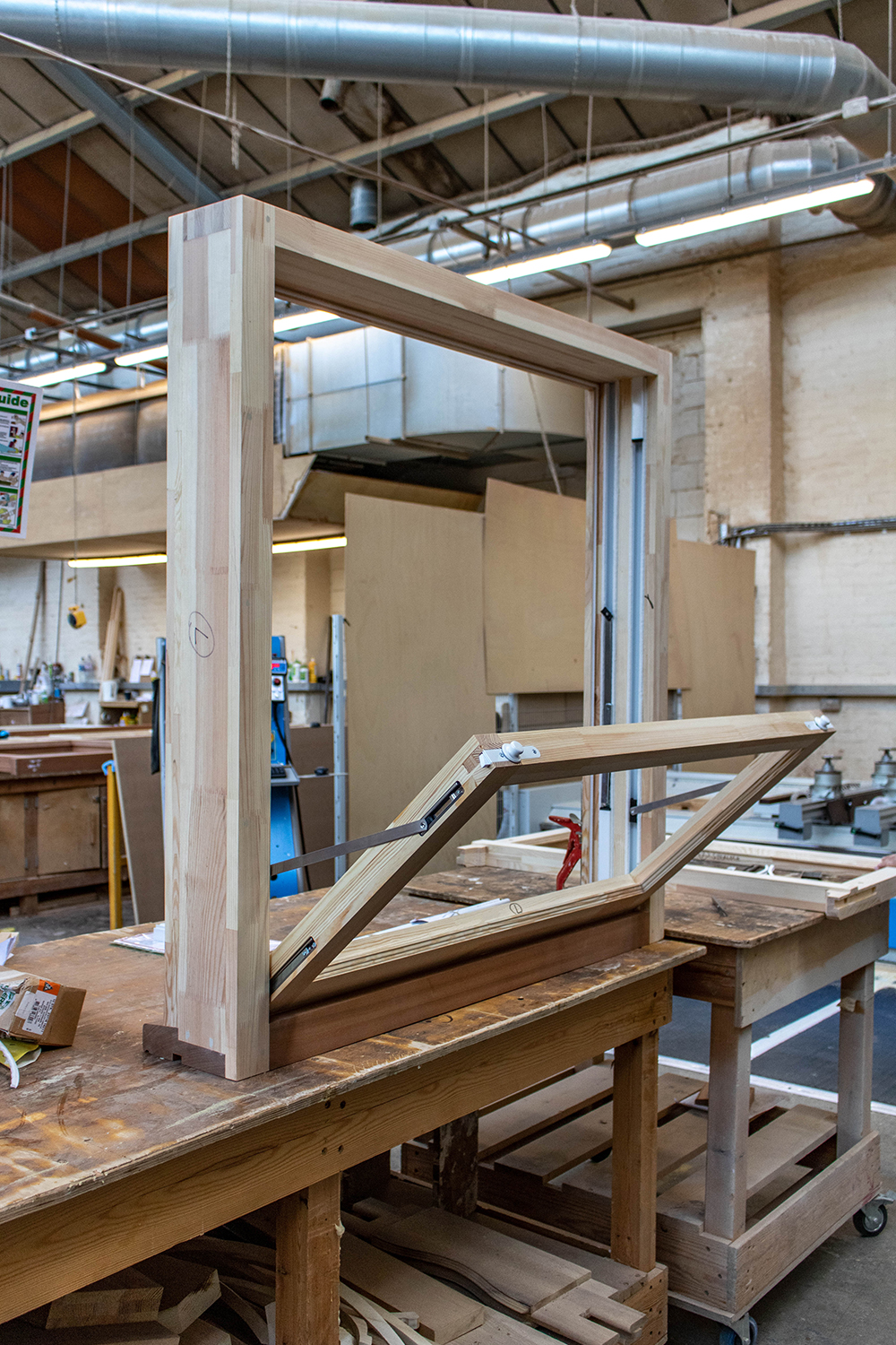 Wood window frame construction in joinery workshop