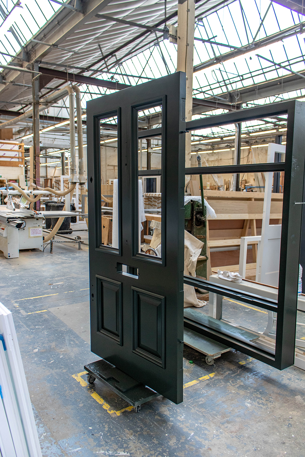 grey painted door construction in joinery workshop