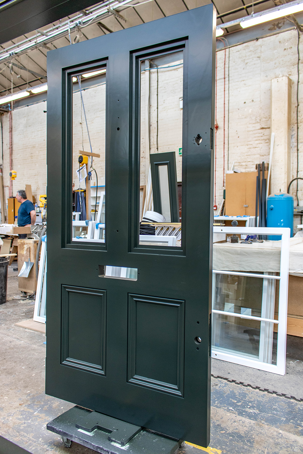 grey painted door construction in joinery workshop
