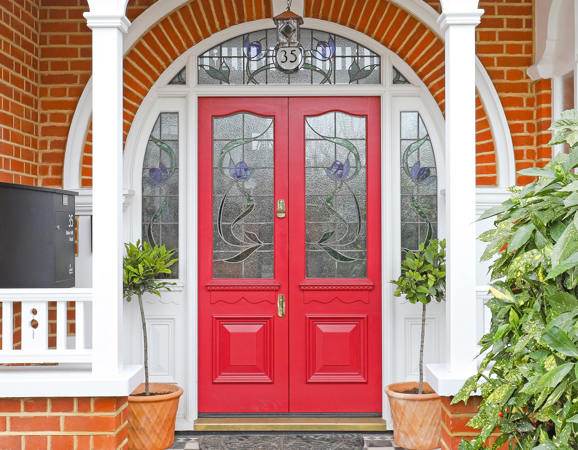 Beautiful double front doors with stained glass and porch in wanstead