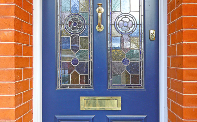 Wooden front door with stained glass
